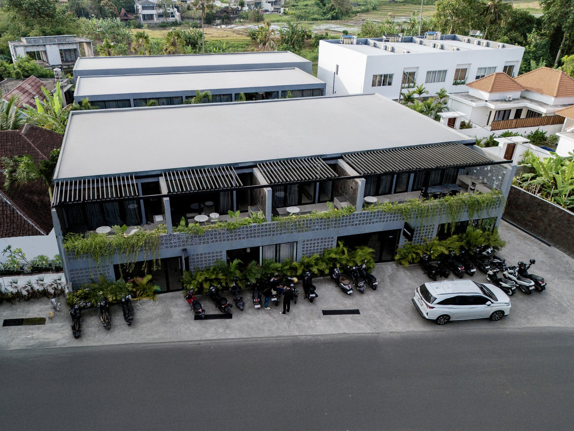 Aerial view — row of private pools between townhouses